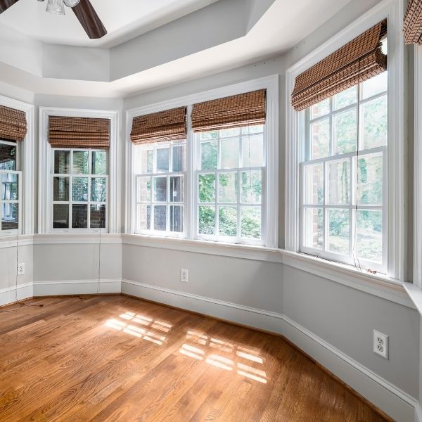 Sunny breakfast nook with bay windows and hardwood floors